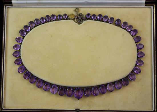 An early 20th century silver gilt and amethyst riviere necklace, 18.5in.